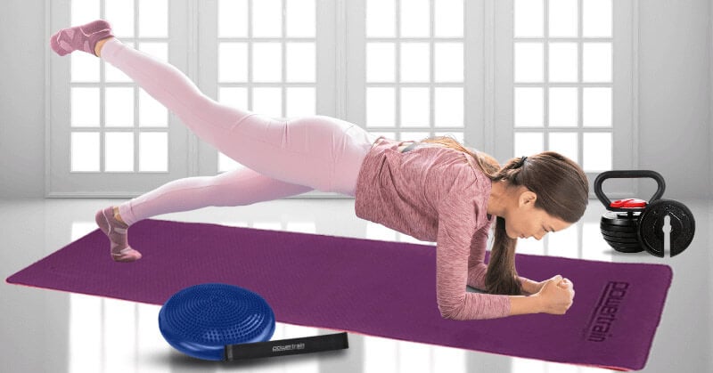 Young woman doing yoga on a Powertrain mat