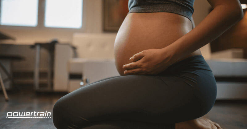 A pregnant woman during prenatal yoga class