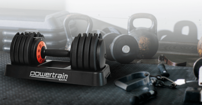 Adjustable dumbbells on the gym floor