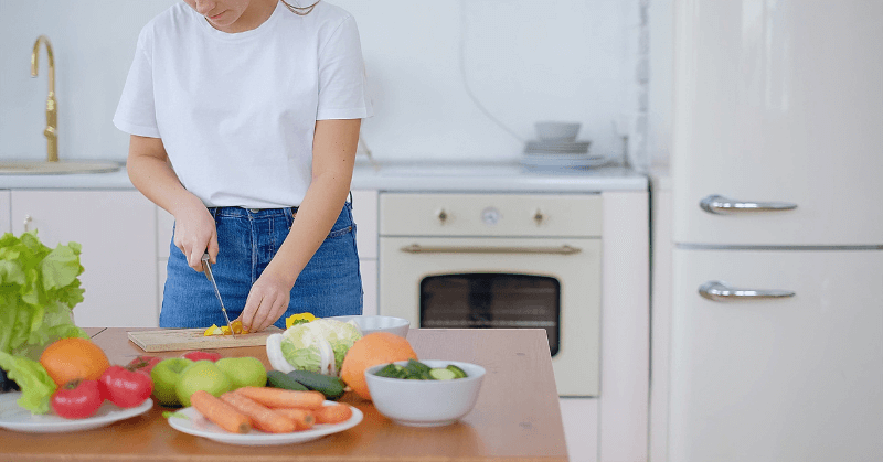 A woman preparing a salad at home