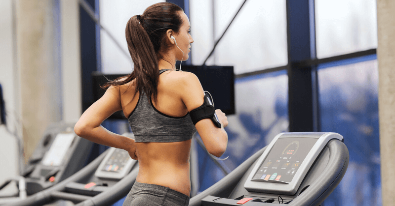 A woman running on a treadmill A woman running on a treadmill