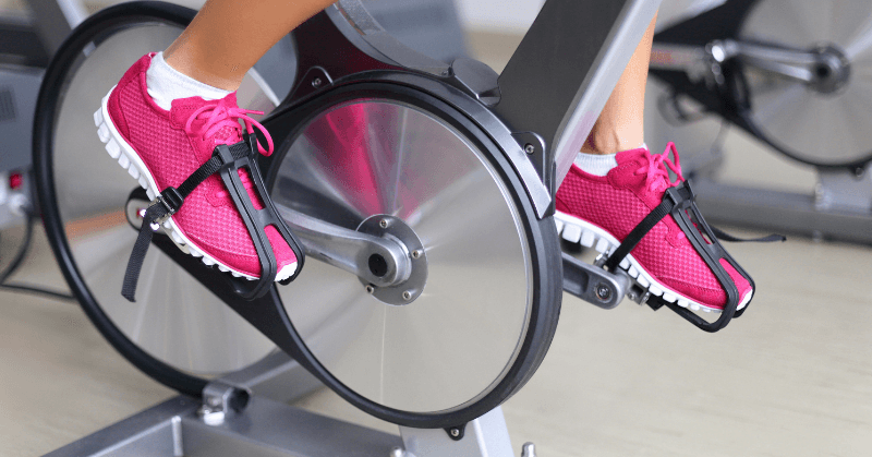 Pink shoes on a spin bike
