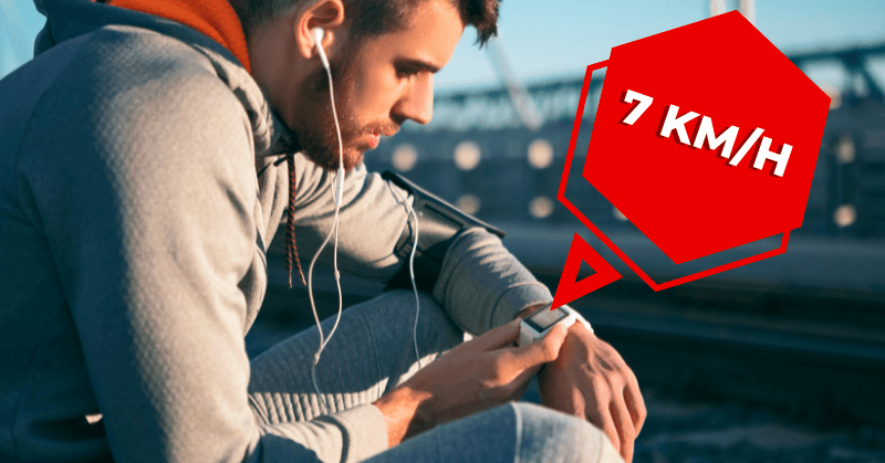 Male runner checking his speed using a smartwatch Male runner checking his speed using a smartwatch