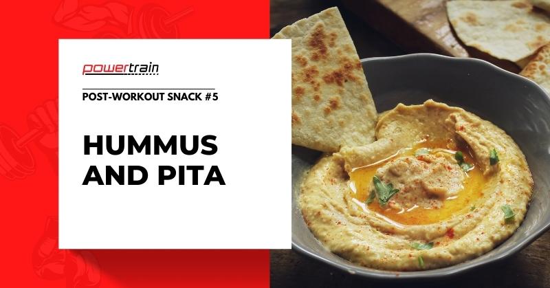 Hummus and pita on a black dish