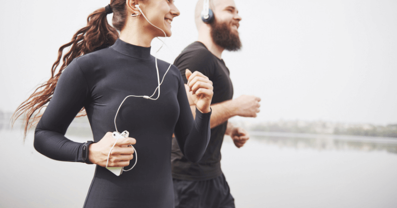 Two runners listening to music