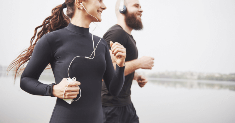 Two runners listening to music Two runners listening to music