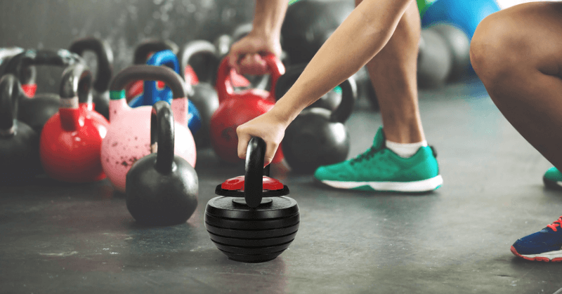 Powertrain adjustable kettlebell in use Powertrain adjustable kettlebell in use