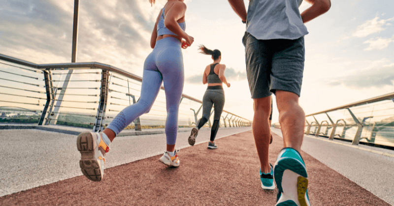 Group of runners on a bridge Group of runners on a bridge